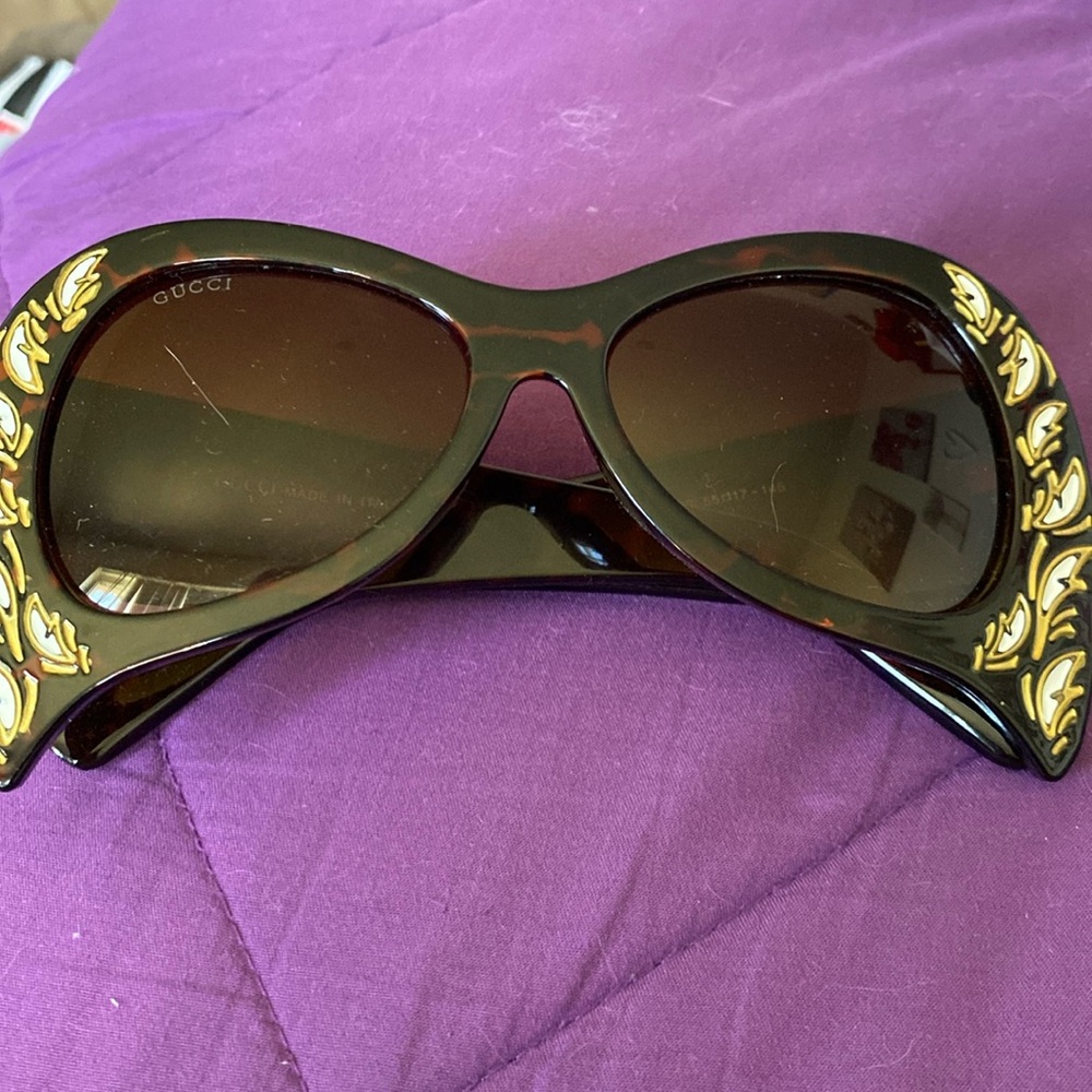 A pair of gucci sunglasses for the unique person who wants to be different